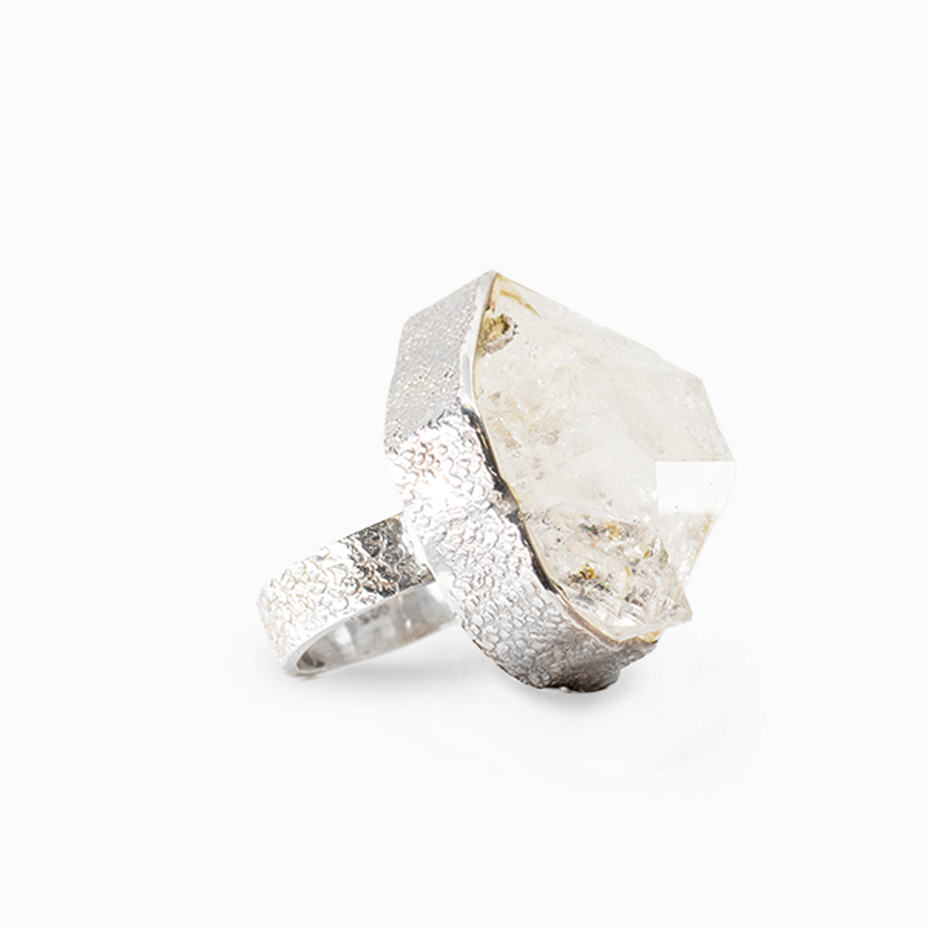 Raw clear Herkimer Diamond quartz crystal set into a textured sterling silver statement ring.