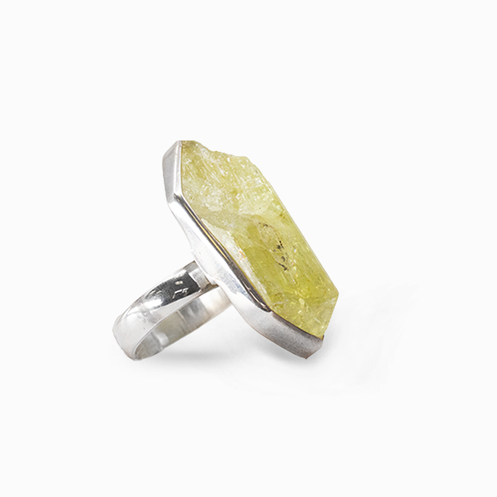 Raw yellow-green Apatite crystal with a natural angular form set in polished sterling silver.