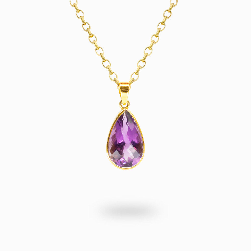 Faceted teardrop Amethyst pendant in a polished 14K gold vermeil bezel setting on a sterling silver base.