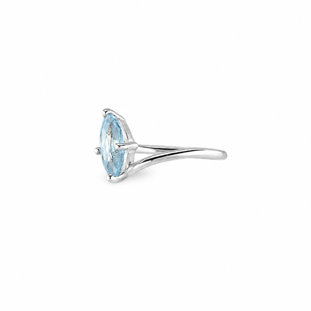 Marquise blue topaz ring with icy faceted gemstone set in sterling silver