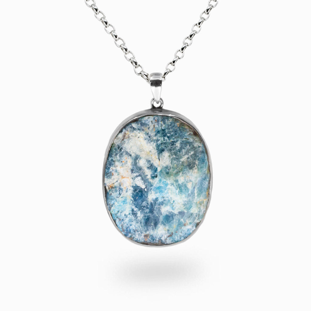 Raw blue apatite oval pendant necklace set in sterling silver bezel. | MADE IN EARTH