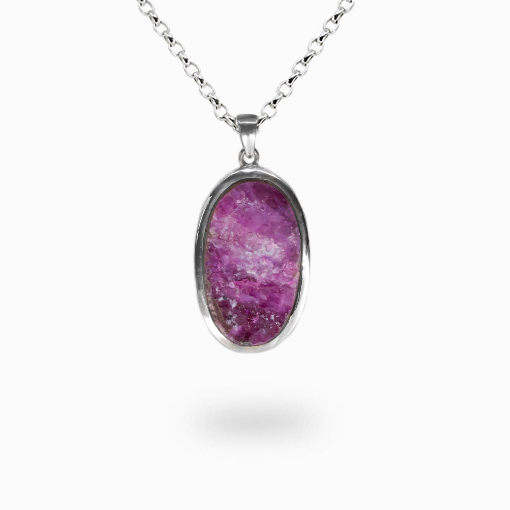 Raw oval Ruby crystal necklace with magenta red natural texture set in sterling silver. | MADE IN EARTH