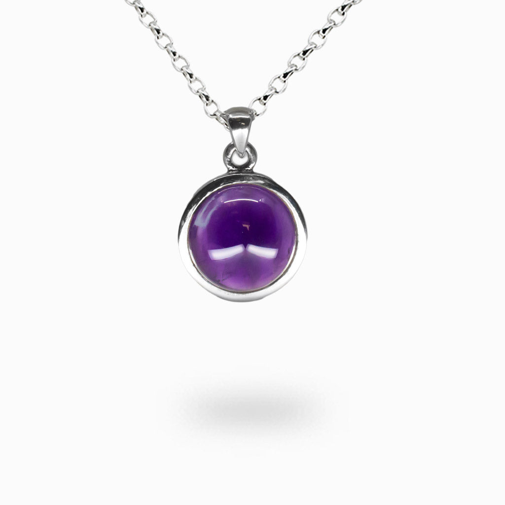 Round amethyst cabochon necklace set in sterling silver with smooth purple gemstone