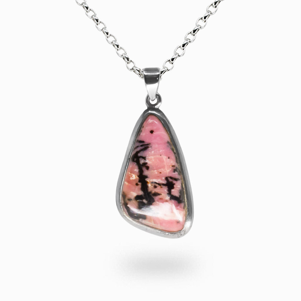 Organically shaped Rhodonite necklace with pink gemstone and black dendritic patterns set in sterling silver