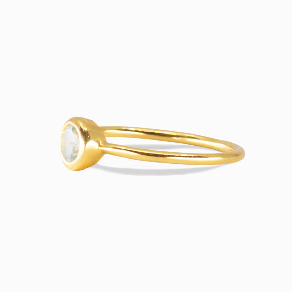 Round blue topaz gold vermeil ring with a minimalist bezel setting | MADE IN EARTH