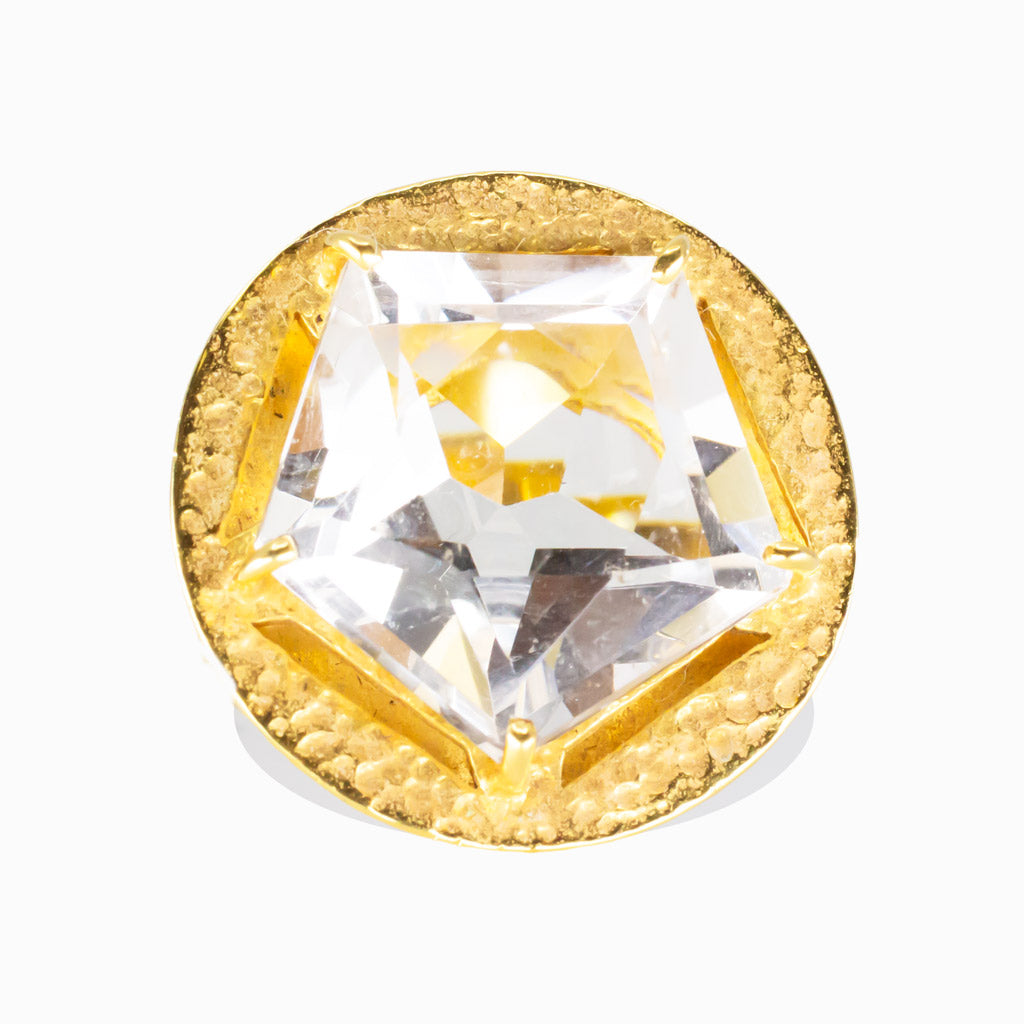 Faceted clear quartz star-cut ring set in a hammered yellow gold vermeil bezel. | MADE IN EARTH