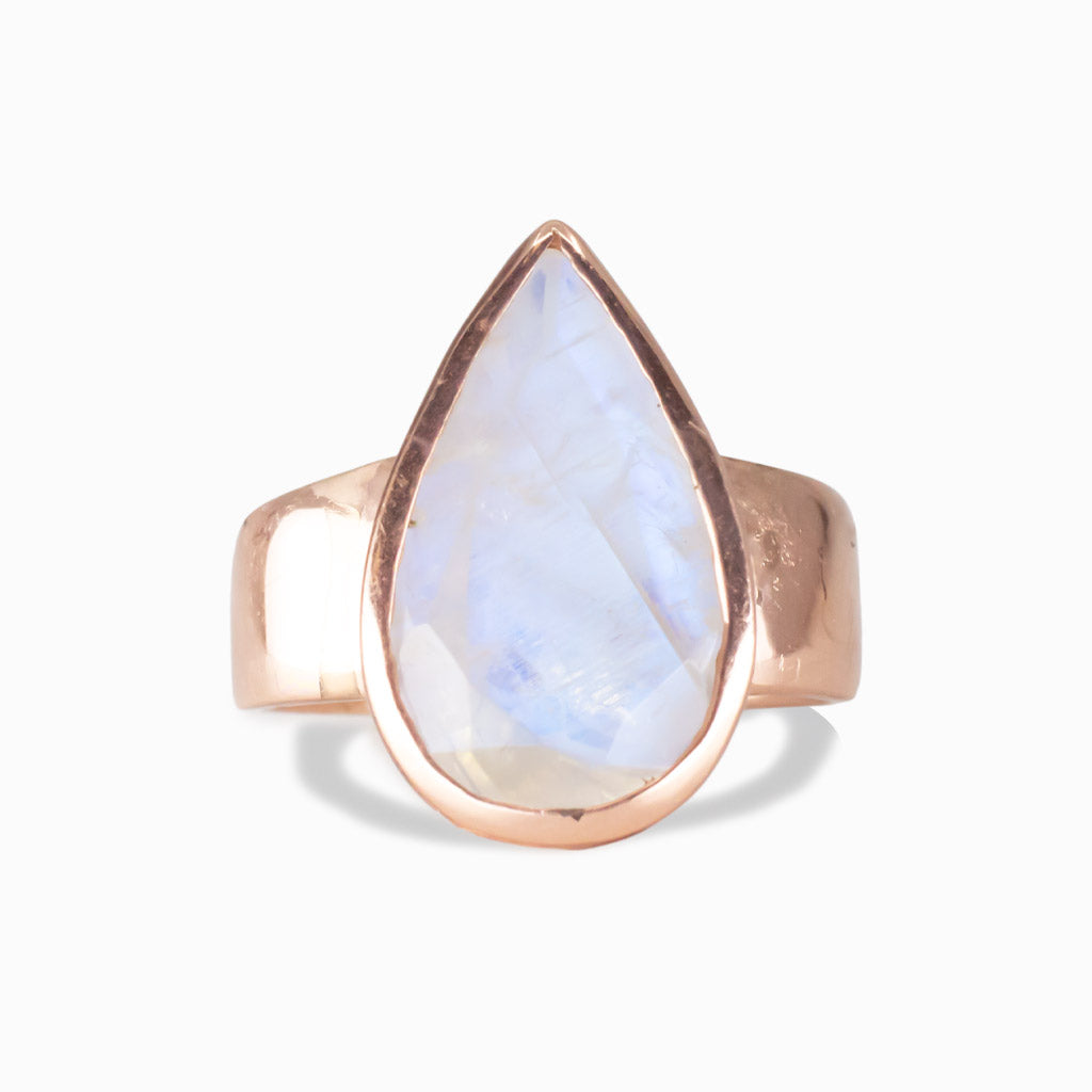 Pear-shaped Rainbow Moonstone ring in rose gold vermeil with blue iridescent sheen on white background |MADE IN EARTH