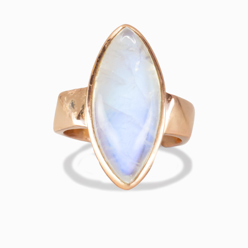Marquise-shaped Rainbow Moonstone ring set in rose gold vermeil with a soft blue iridescent glow. | MADE IN EARTH
