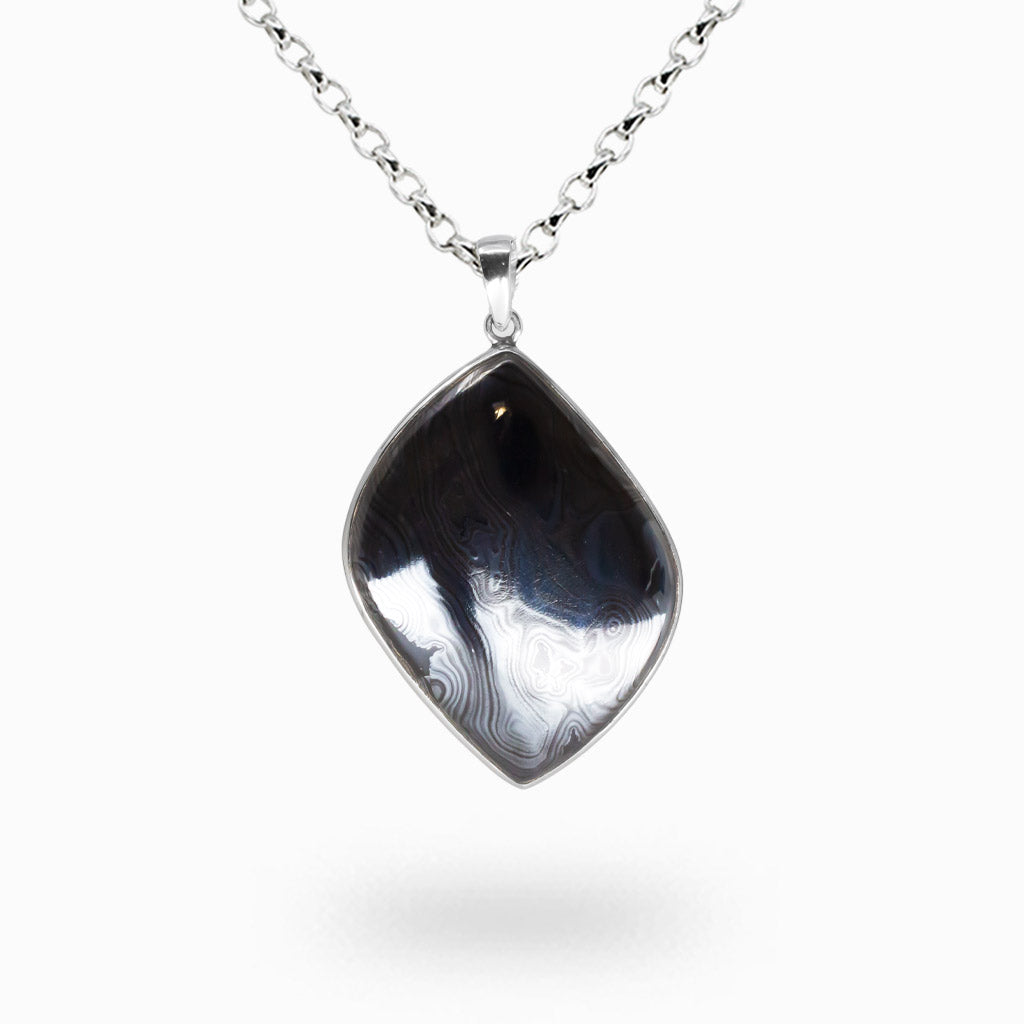 Psilomelane teardrop necklace set in sterling silver with black cabochon gemstone pendant