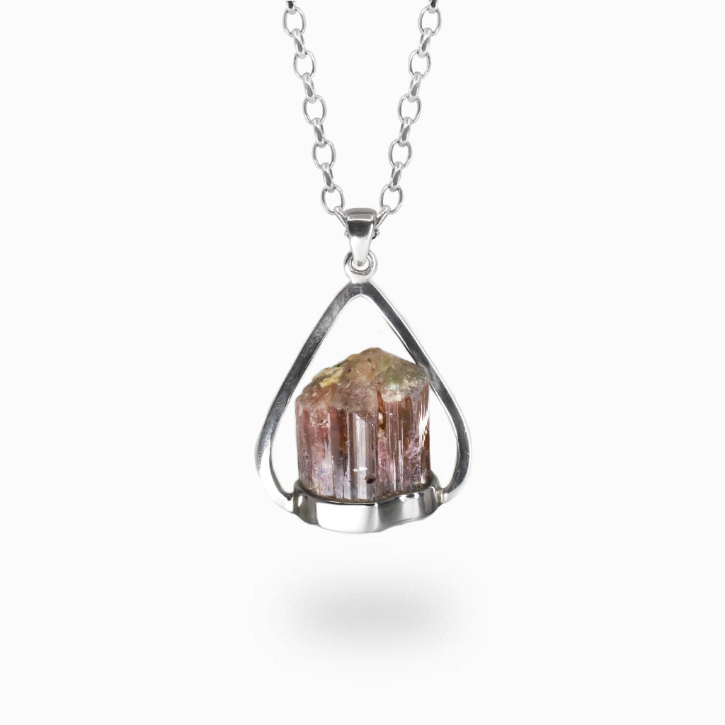 Raw pink tourmaline druzy halo pendant set in sterling silver with vibrant pink crystal texture. | MADE IN EARTH