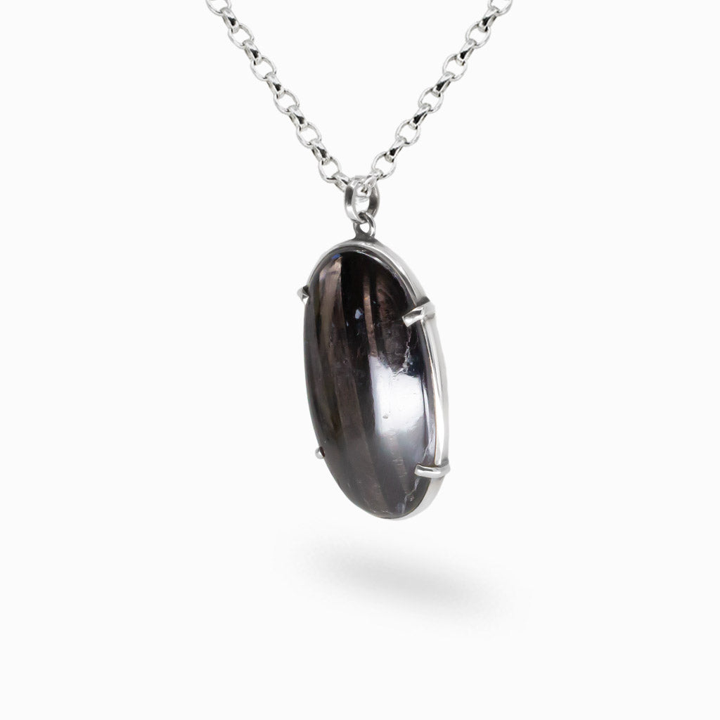 Oval hypersthene cabochon pendant set in sterling silver on chain. MADE IN EARTH