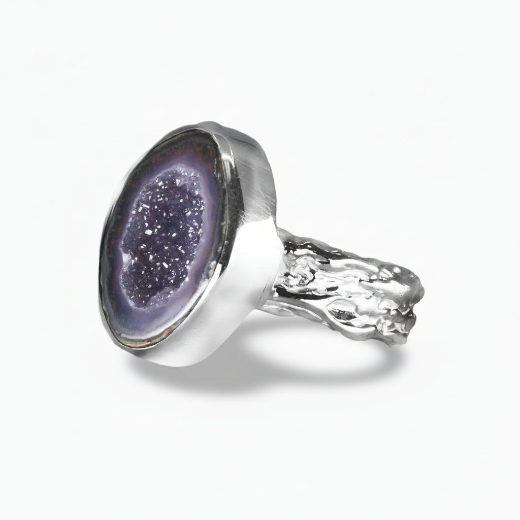 Purple Agate geode druzy ring with sparkling crystal center and sterling silver bezel textured band setting on a white background. | MADE IN EARTH
