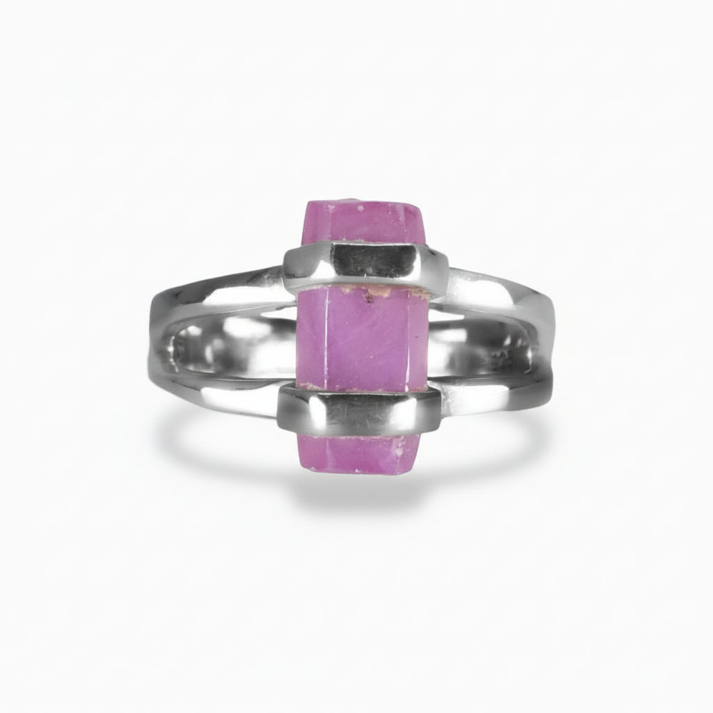 Raw pink-red Ruby pencil crystal ring set in sterling silver double-band design on a white background. MADE IN EARTH