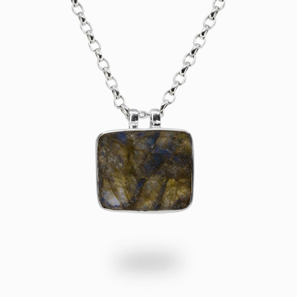 Raw rectangular Labradorite pendant necklace in sterling silver featuring natural blue and gold iridescent flashes.