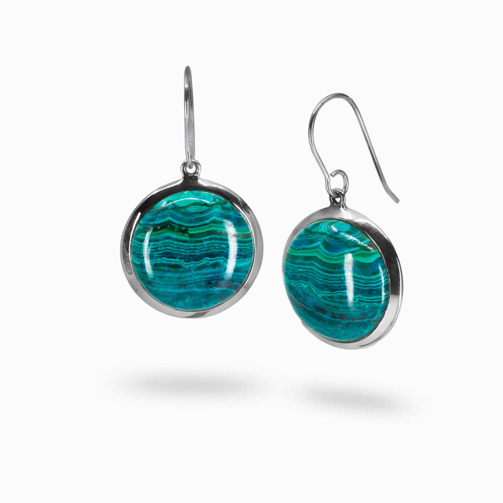 Round Chrysocolla and Malachite cabochon sterling silver drop earrings with French hooks, featuring vibrant blue-green layered patterns. | MADE IN EARTH