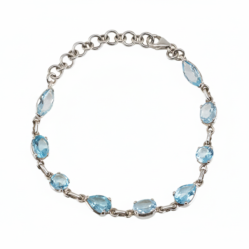 Multishape blue topaz bracelet with faceted stones in sterling silver