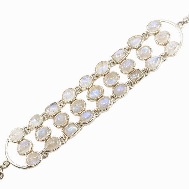 Rainbow Moonstone statement bracelet in sterling silver with mixed cabochon gemstone shapes.