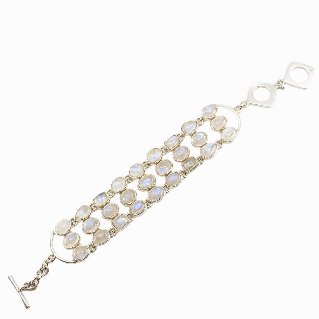 Rainbow Moonstone statement bracelet in sterling silver with mixed cabochon gemstone shapes.