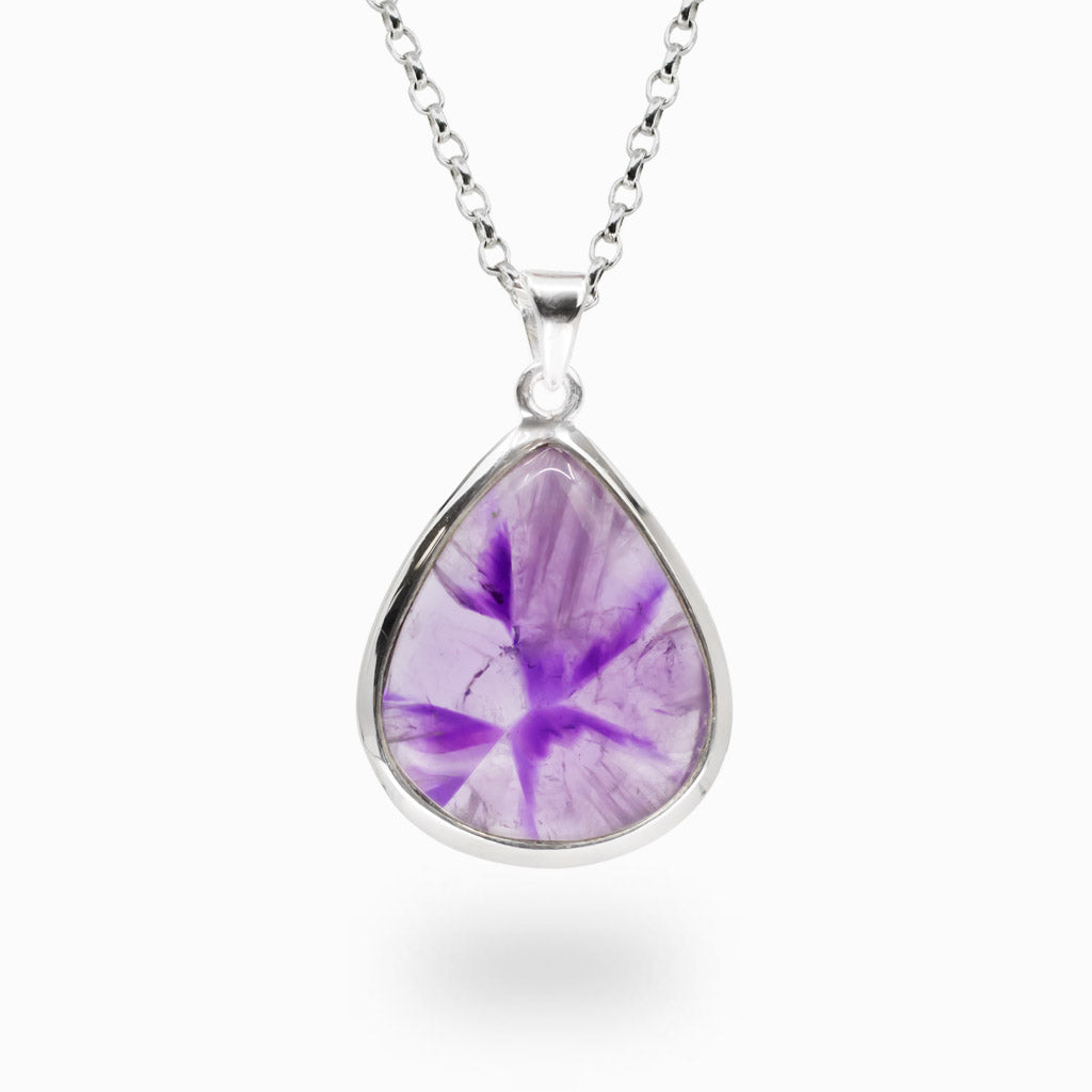 Pear-shaped Auralite 23 gemstone pendant set in sterling silver on a matching silver chain.