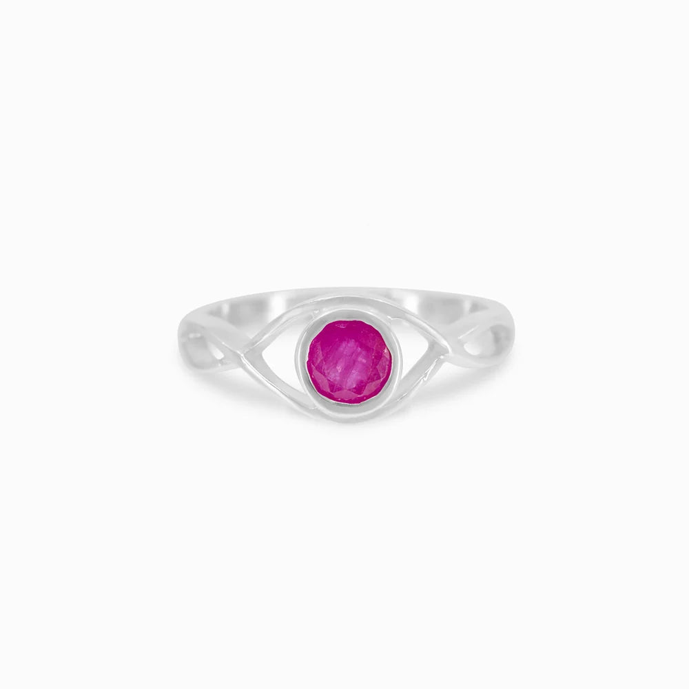 Round faceted pink-red Ruby gemstone in polished sterling silver eye design ring.
