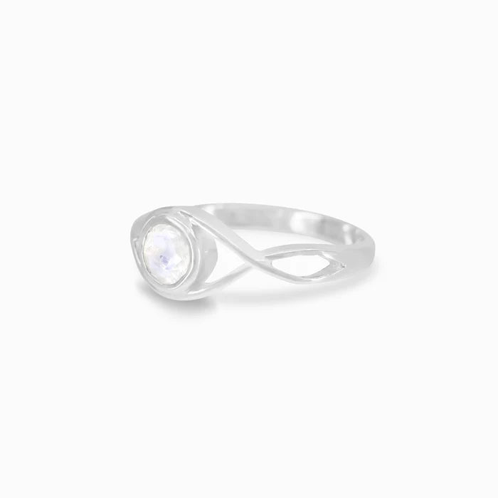 Round faceted Rainbow Moonstone gemstone in polished sterling silver eye design ring.
