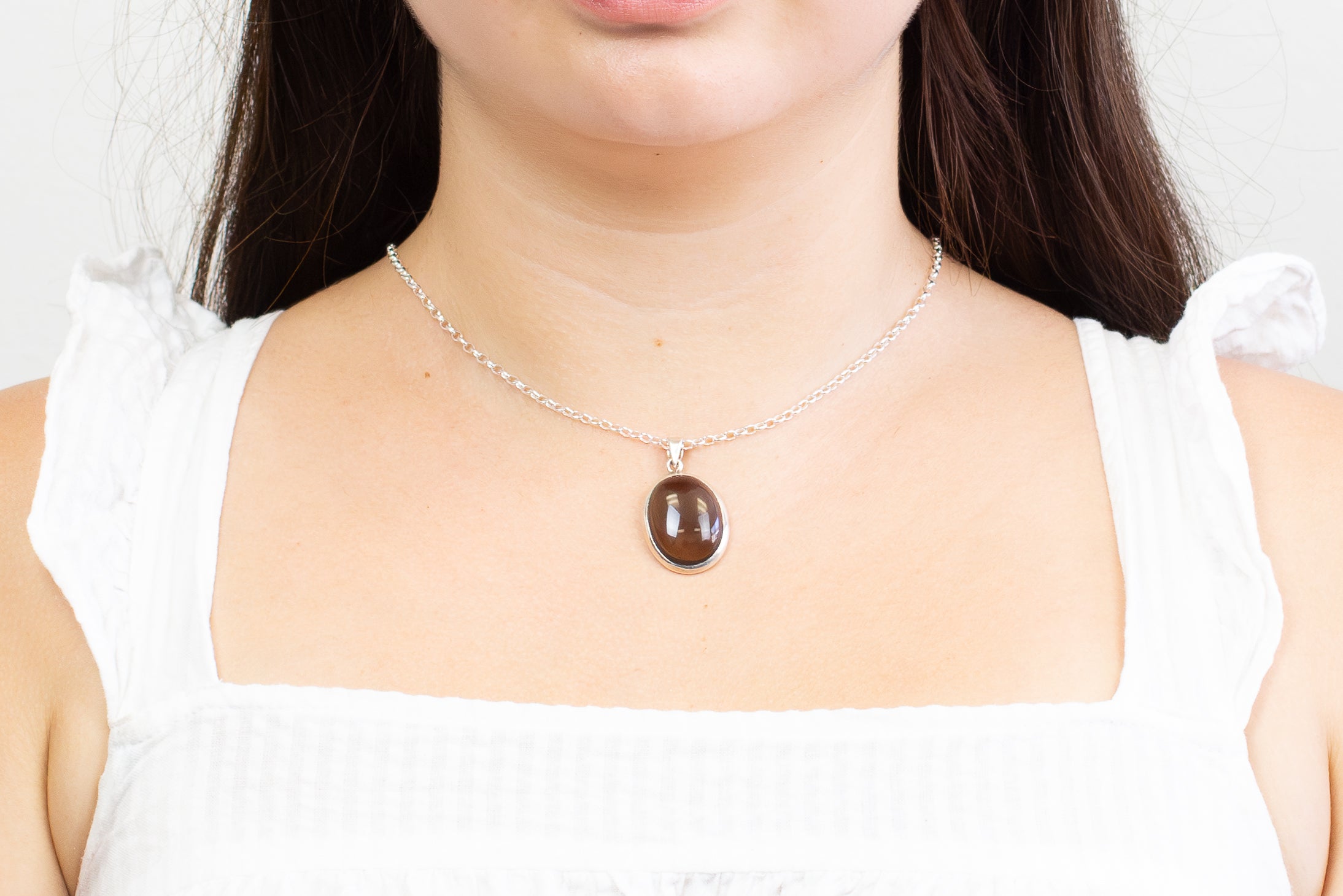 CABOCHON SMOKEY QUARTZ OVAL PENDANT WITH STERLING SILVER BEZEL