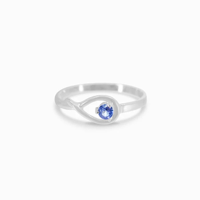 Round faceted Tanzanite gemstone prong set in polished sterling silver ring