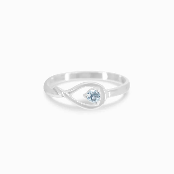 Round faceted Aquamarine gemstone prong set in polished sterling silver ring.