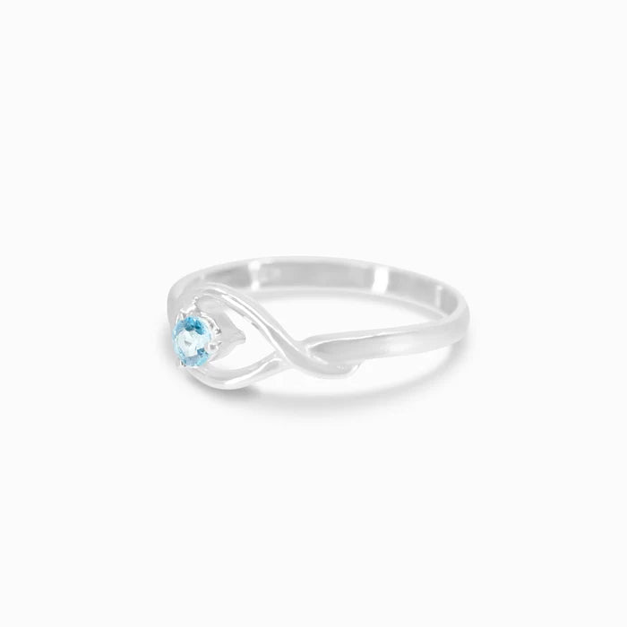 Round faceted Blue Topaz gemstone prong set in polished sterling silver ring.