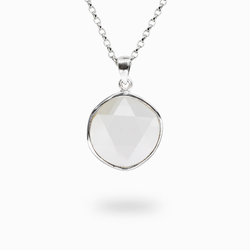 Round Clear Quartz Merkaba gemstone pendant handcrafted in sterling silver on a matching silver chain.
