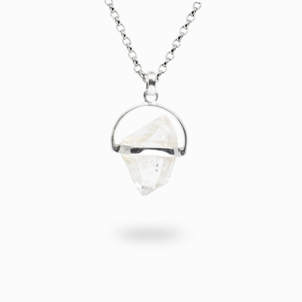 Natural Herkimer Diamond crystal suspended in a modern sterling silver pendant on a matching silver chain.