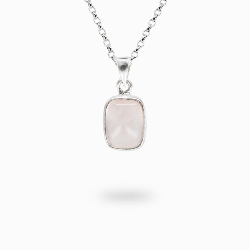 Cushion-shaped Rose Quartz gemstone pendant handcrafted in sterling silver with soft blush pink color.