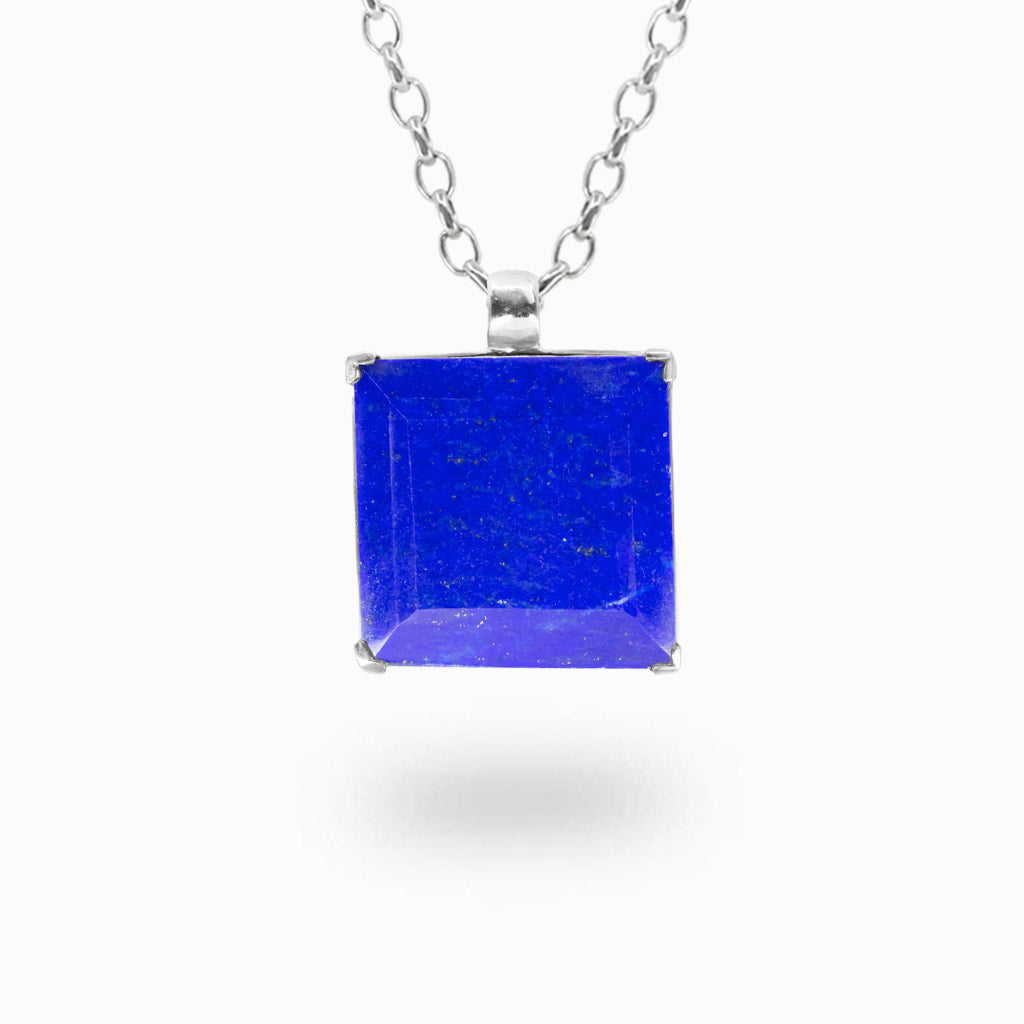 Faceted Lapis Lazuli necklace in sterling silver. Natural royal blue gemstone pendant with subtle pyrite accents.