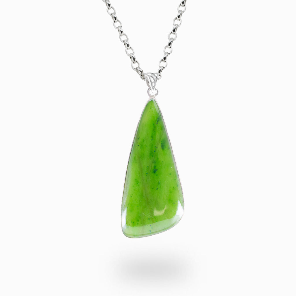 Freeform Nephrite Jade pendant necklace in sterling silver featuring natural bright green gemstone.