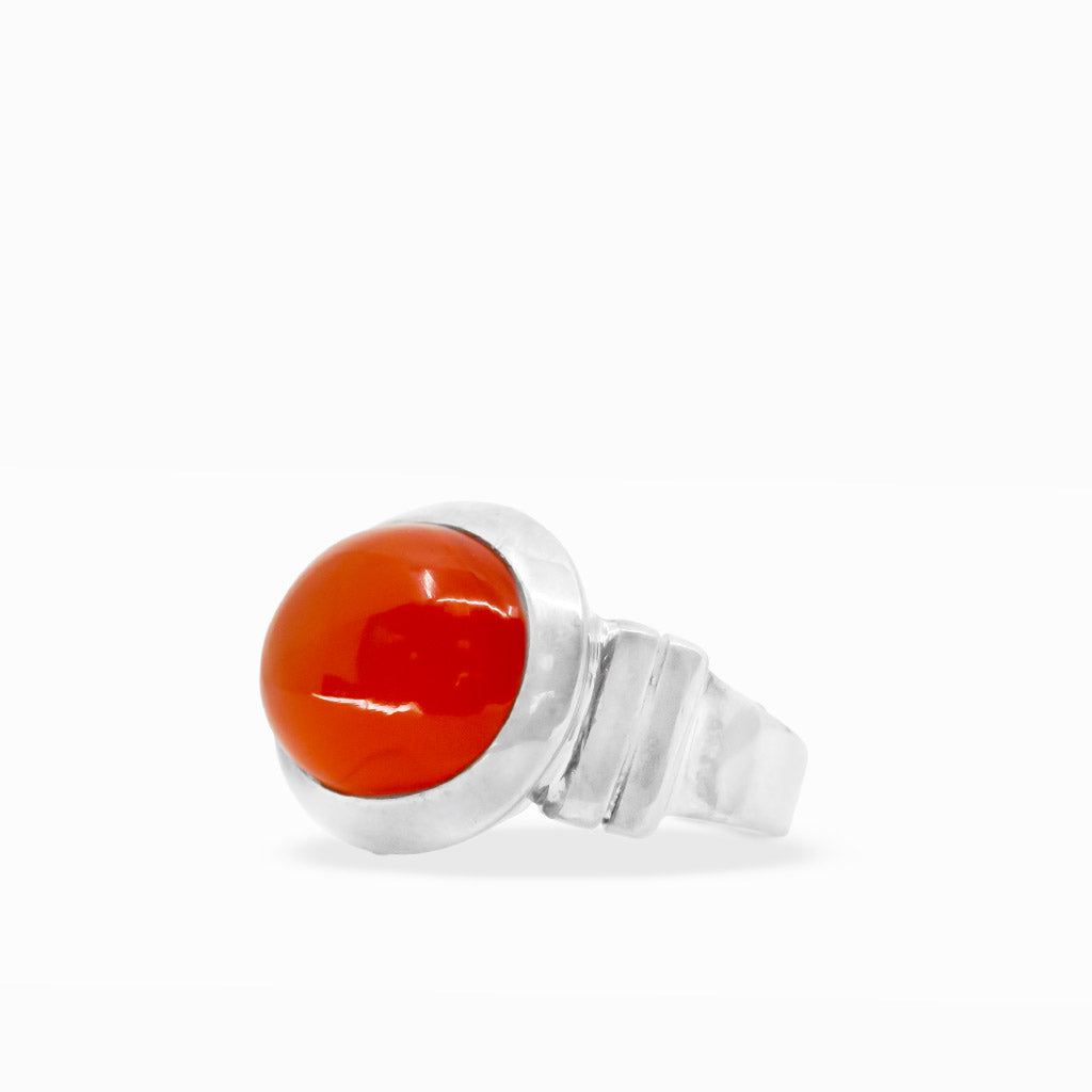 Bright orange-red oval Carnelian cabochon ring with smooth polished surface and wide sterling silver bezel setting.