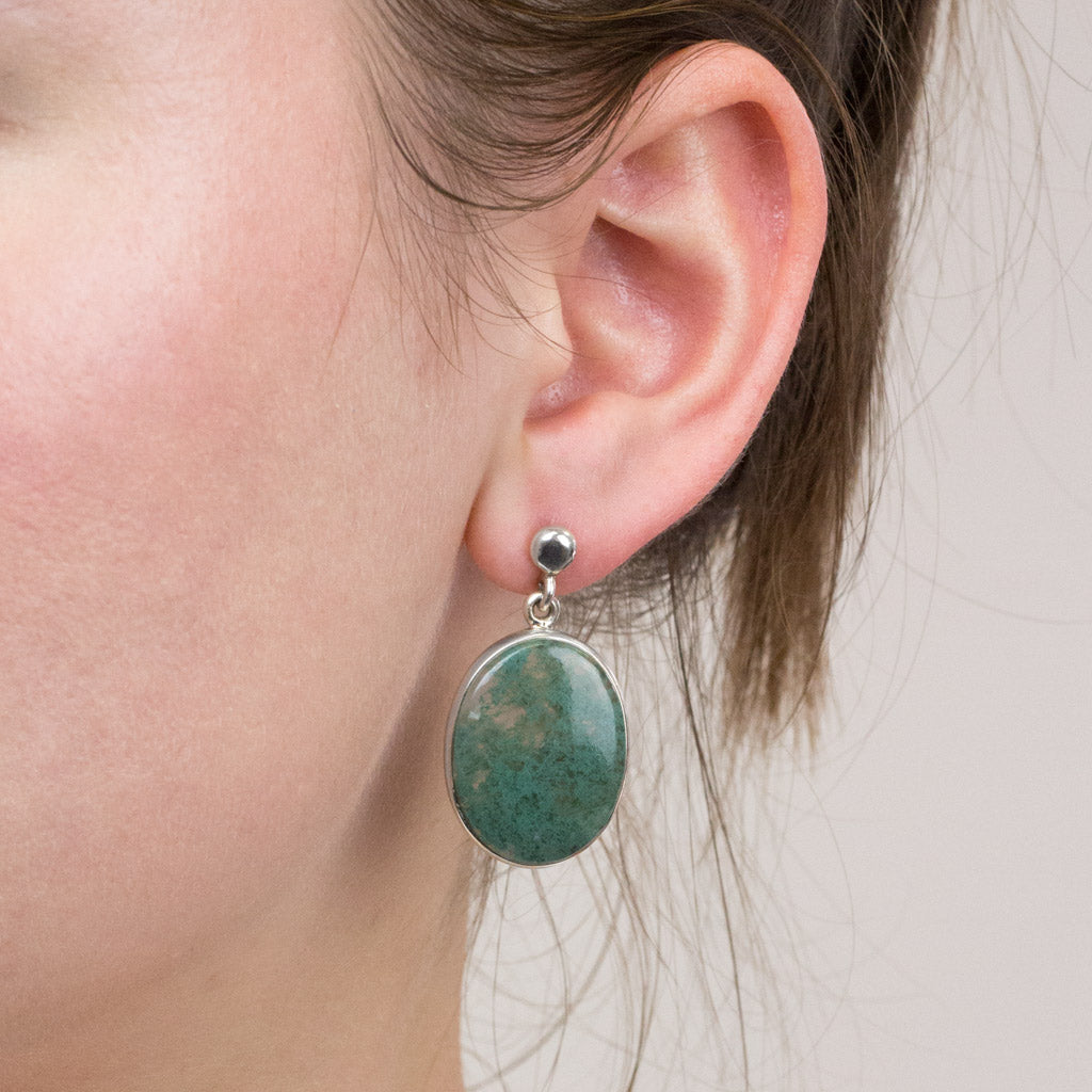 Moss Agate stud earrings on model