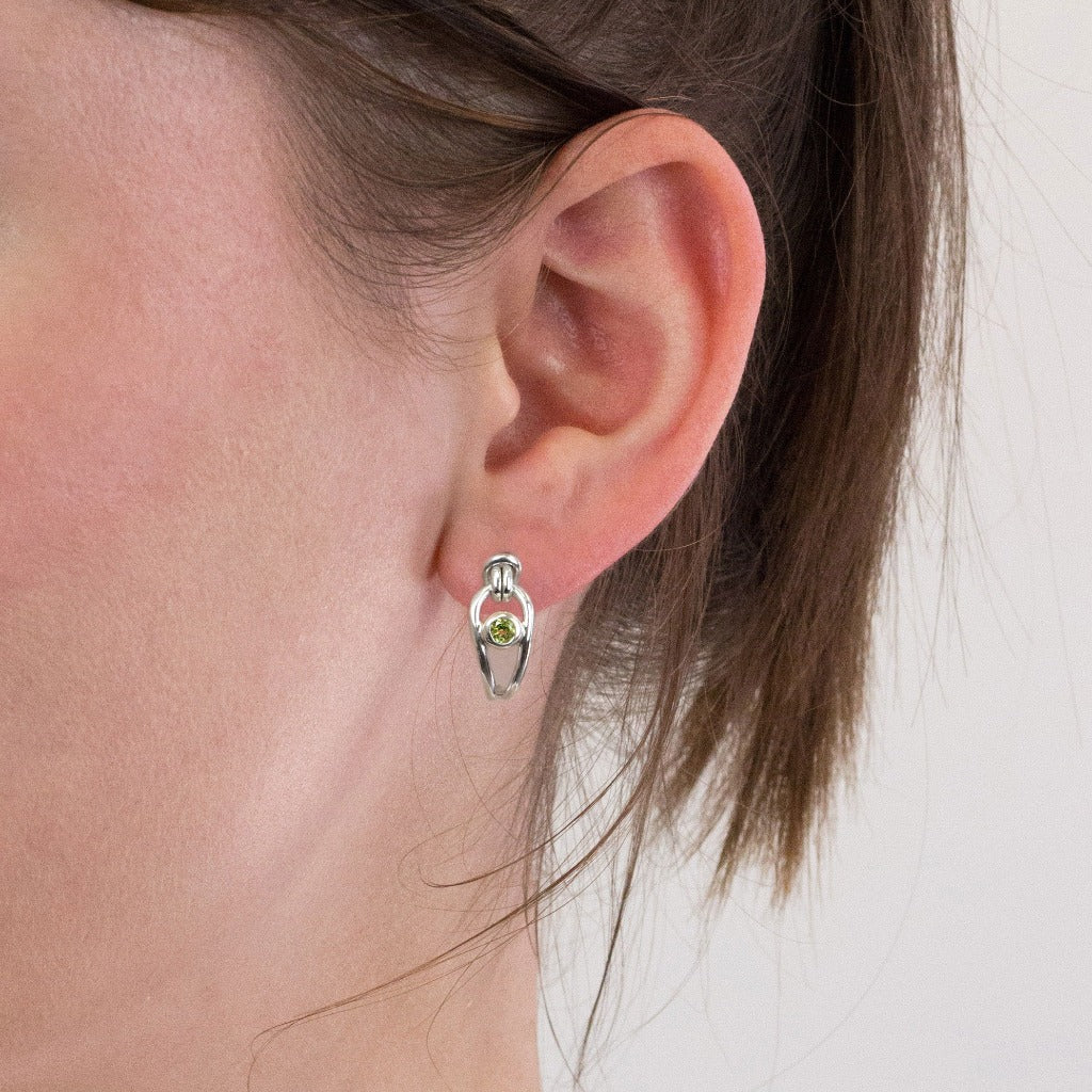 Peridot stud earrings on model