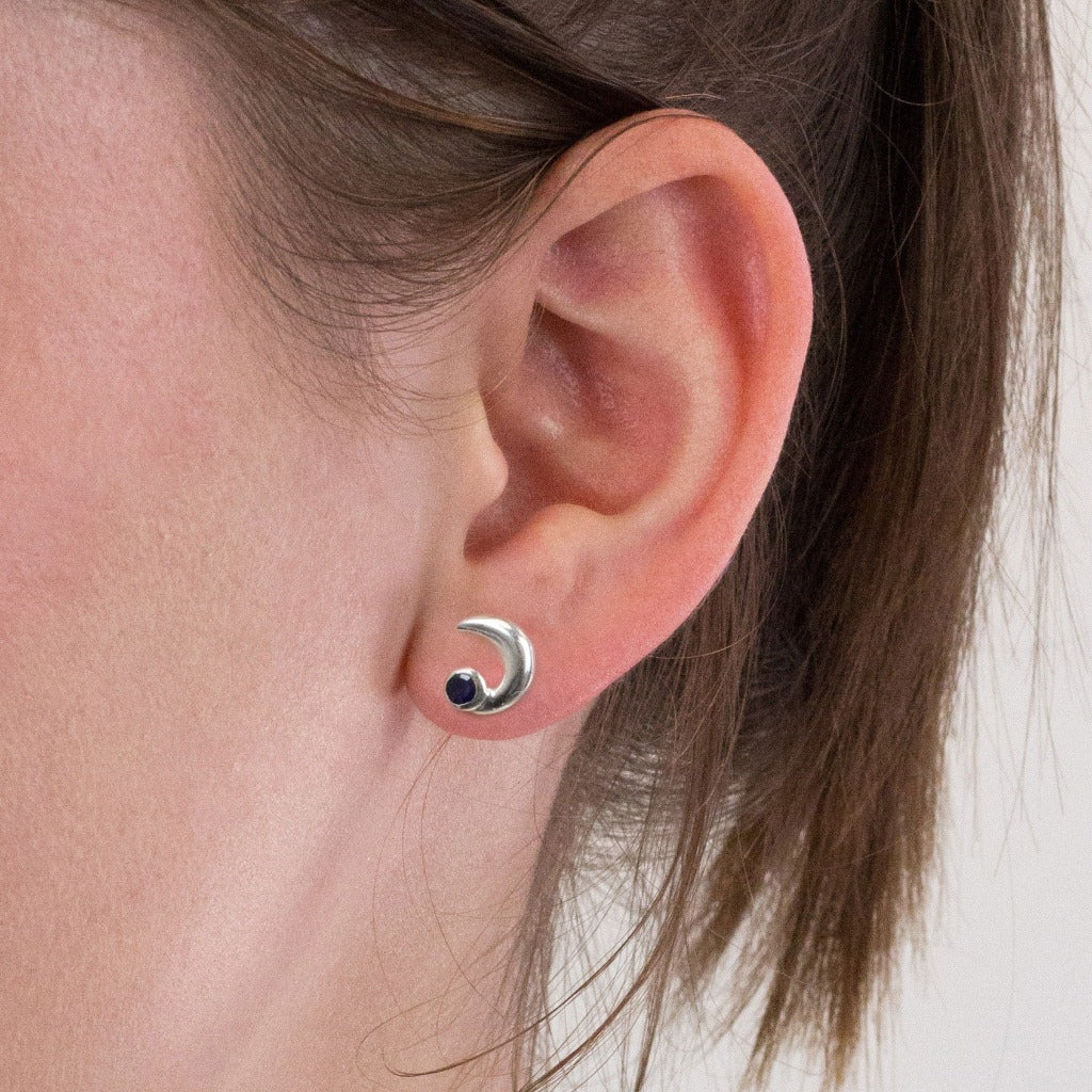 Sapphire stud earrings on model