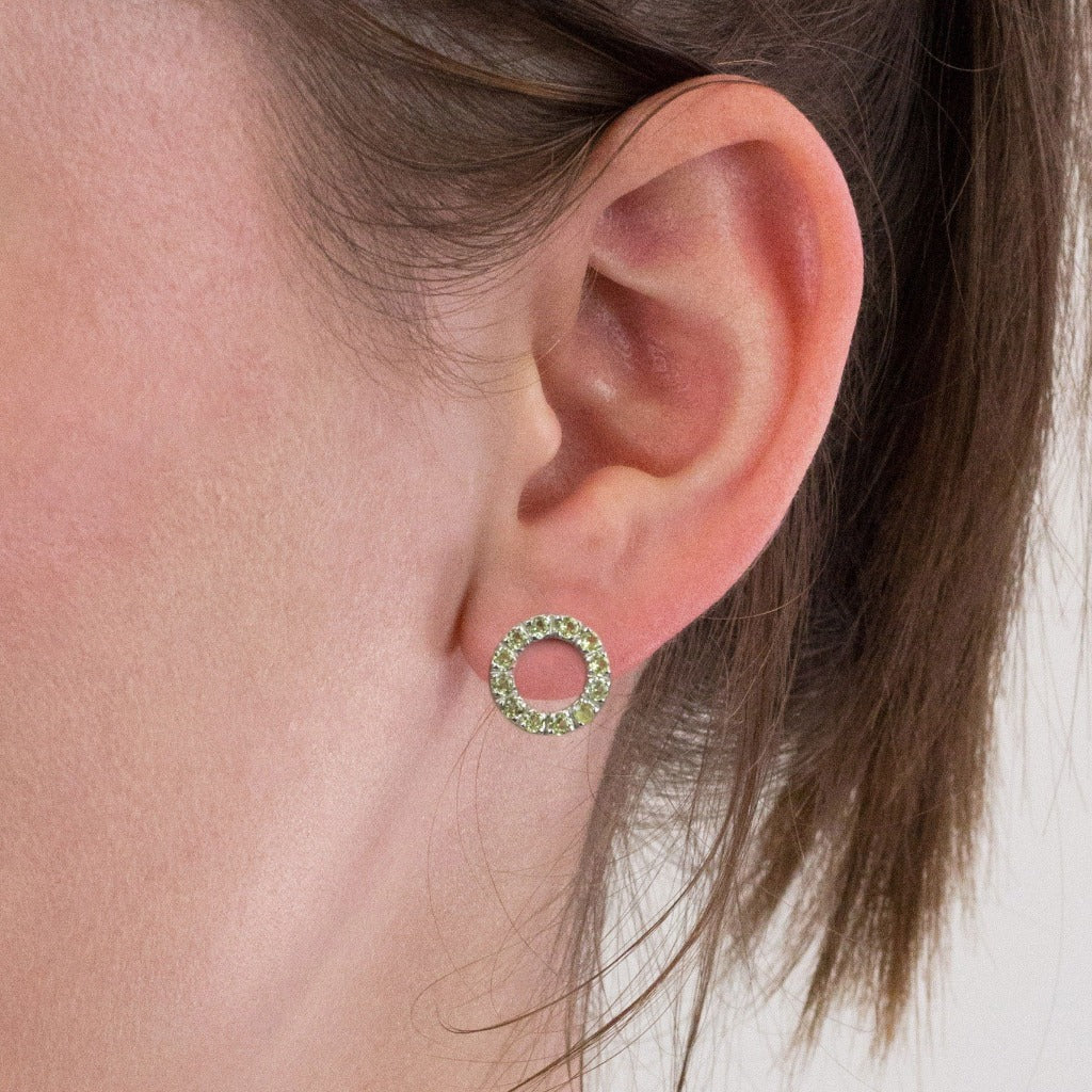 Peridot stud earrings on model