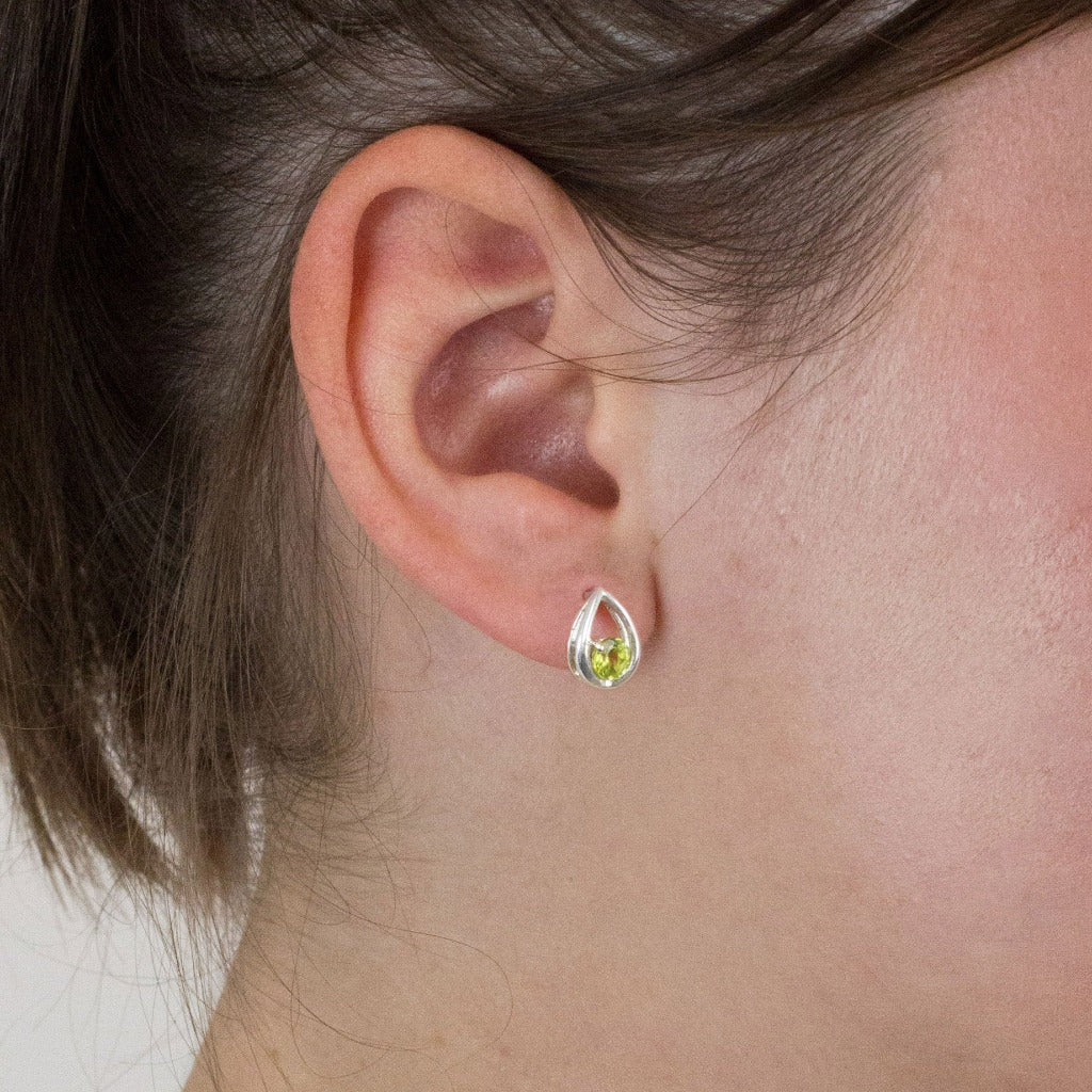 Peridot stud earrings on model