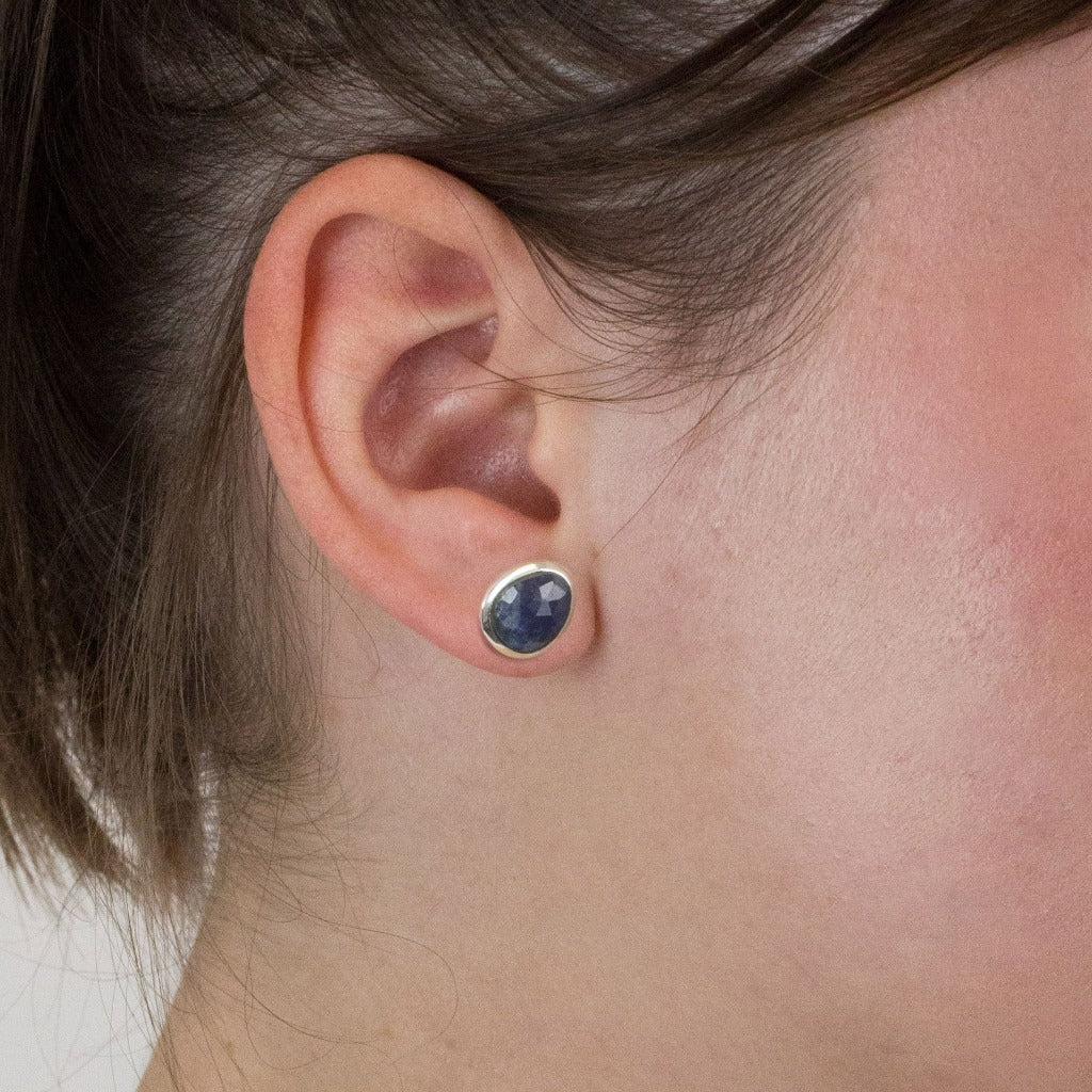 Sapphire stud earrings on model