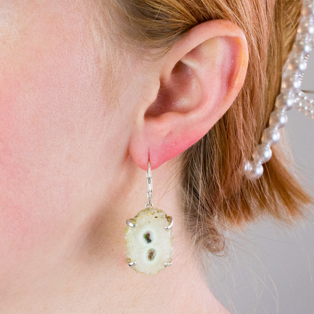 solar quartz earrings on model