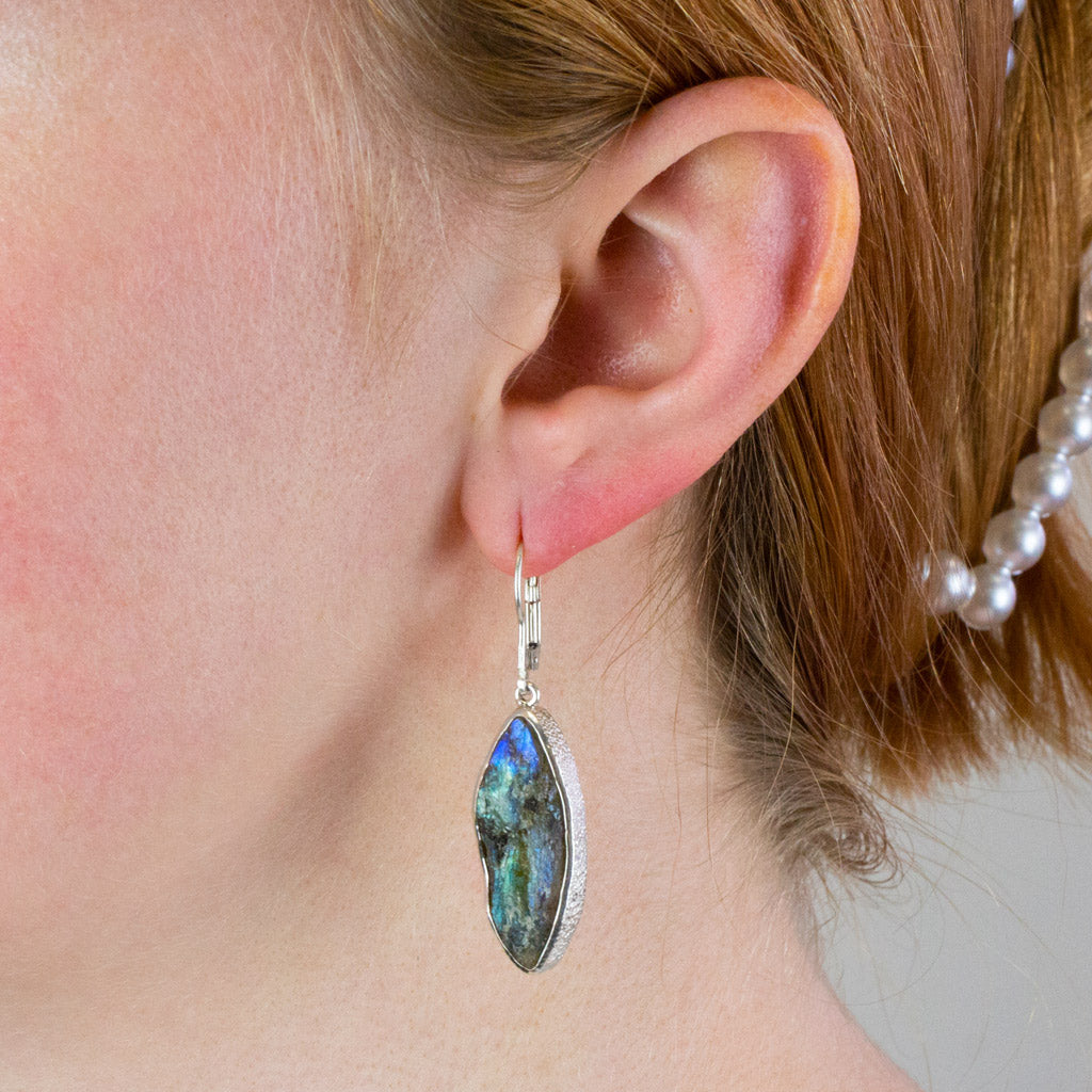 raw labradorite drop earrings on model