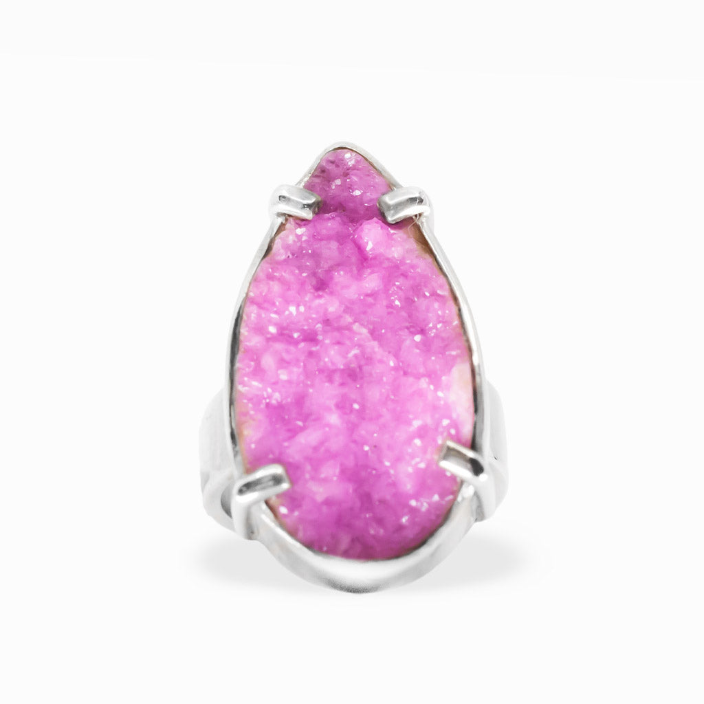 Bright pink pear-shaped Cobaltian Calcite druzy ring with sparkling crystalline texture and polished sterling silver prong setting.