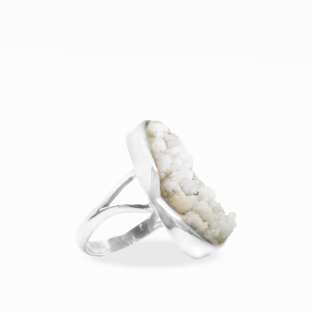 Freeform Hoar Frost ring with delicate white druzy crystal formations, polished sterling silver bezel setting, and split band.