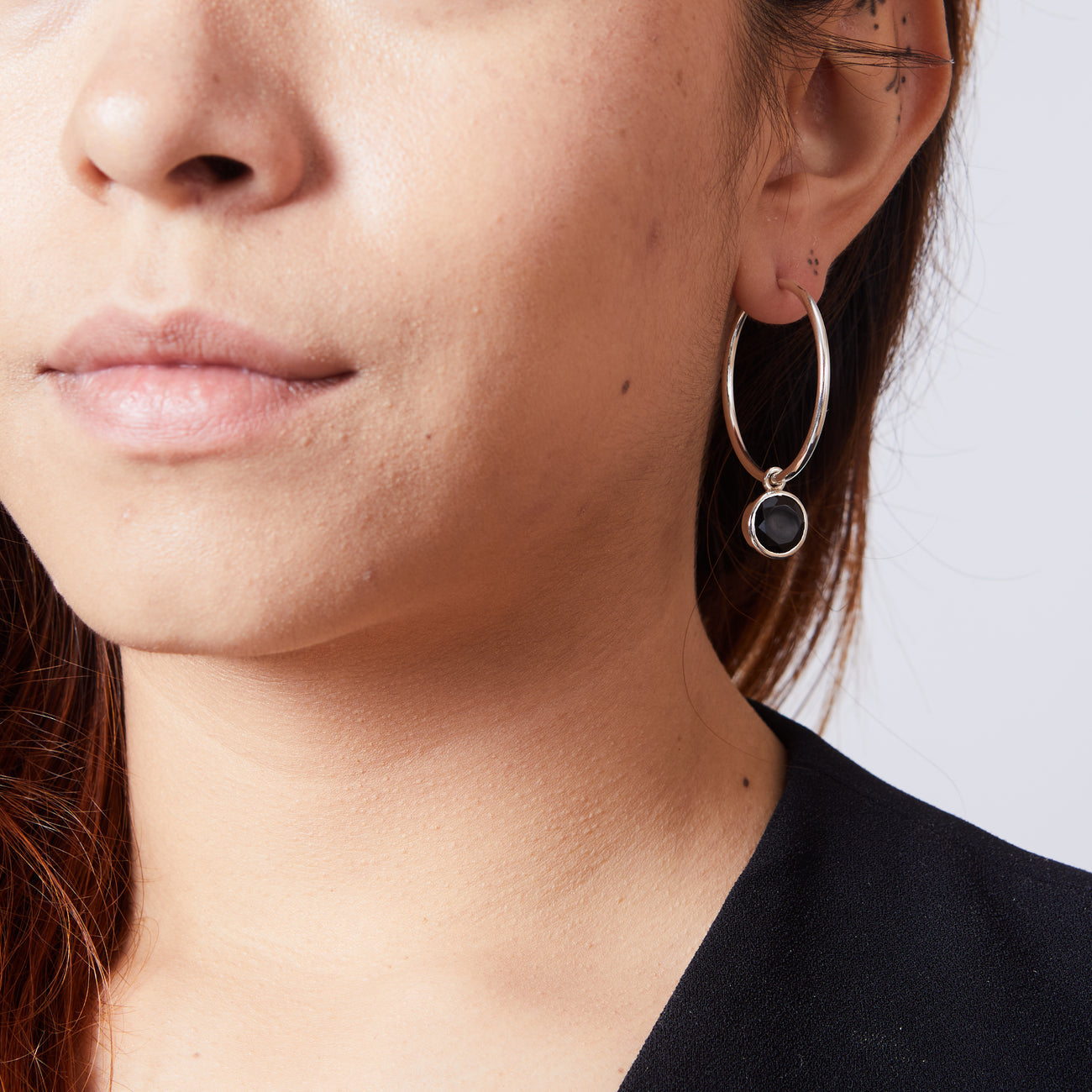 FACETED ONYX HOOP CHARMS ON MODEL