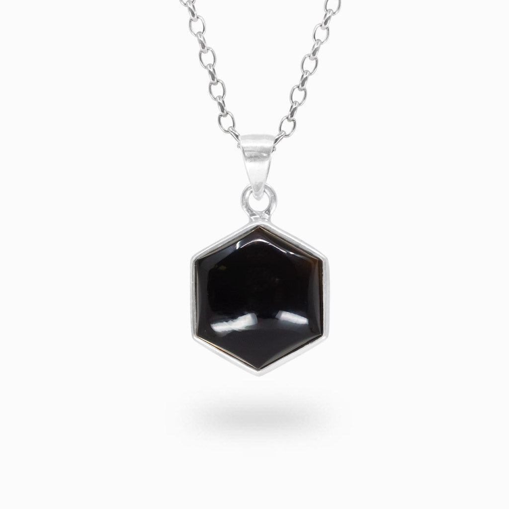 Hexagonal polished Black Onyx cabochon pendant in a polished 925 sterling silver bezel setting.