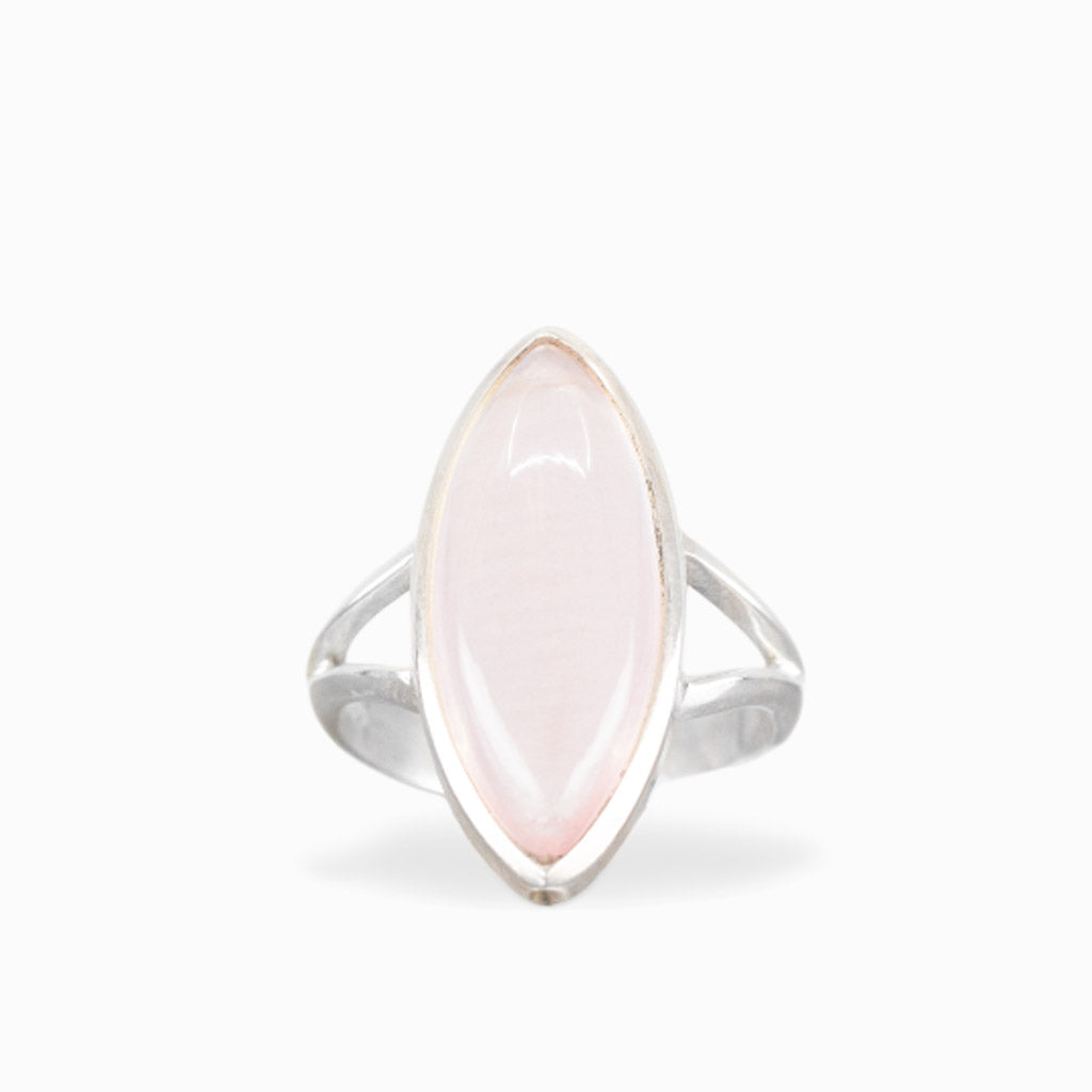 Marquise Rose Quartz ring with soft blush-pink cabochon, polished sterling silver bezel setting, and elegant split band.