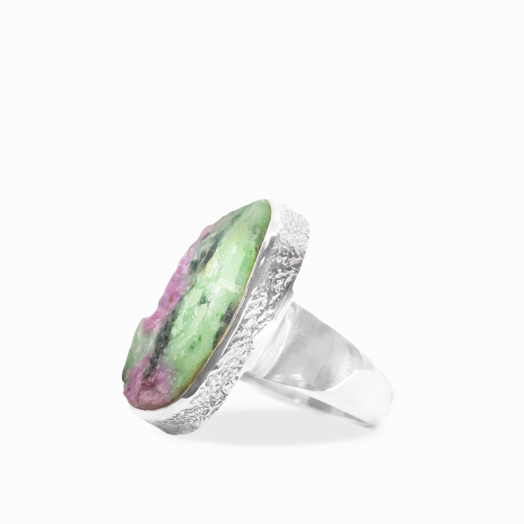 Rectangular Ruby Zoisite ring with vivid green Zoisite, pink Ruby patches, black mineral inclusions, and polished sterling silver bezel.