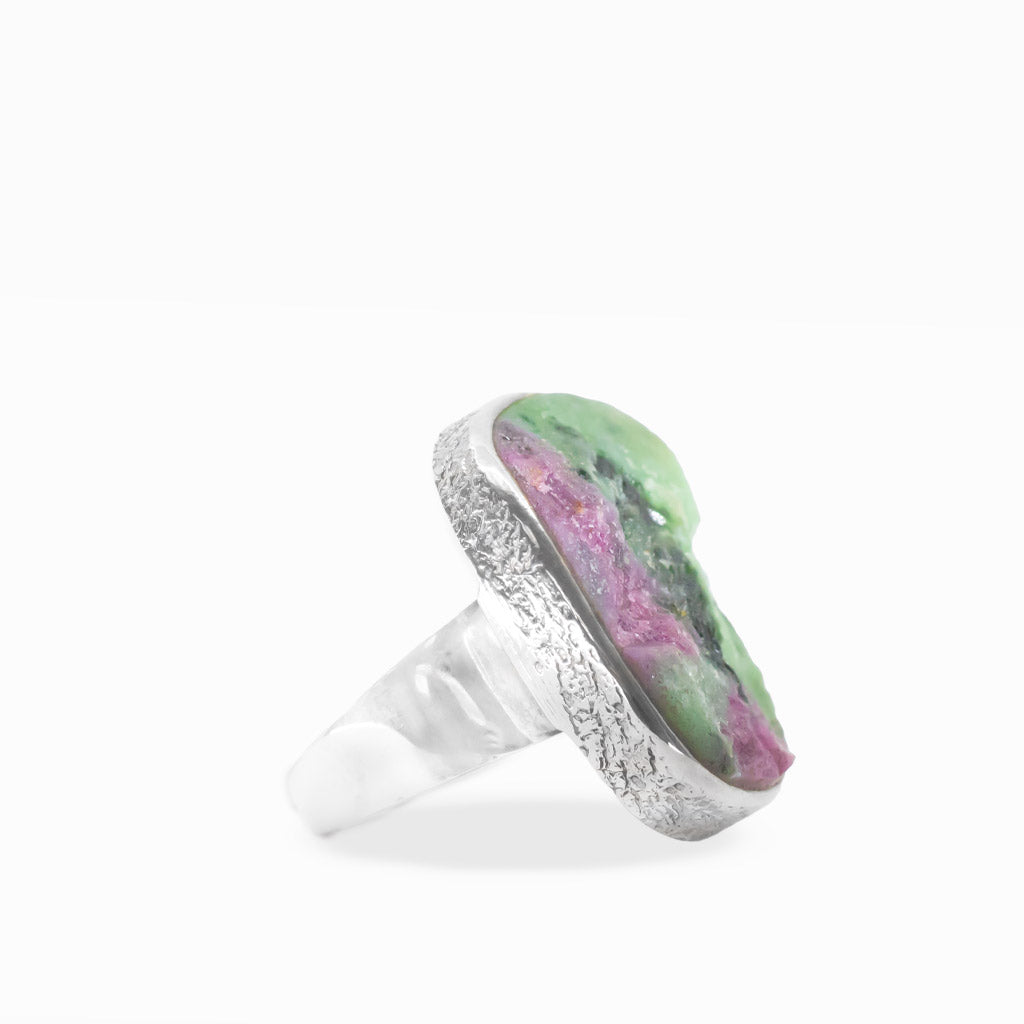 Rectangular Ruby Zoisite ring with vivid green Zoisite, pink Ruby patches, black mineral inclusions, and polished sterling silver bezel.